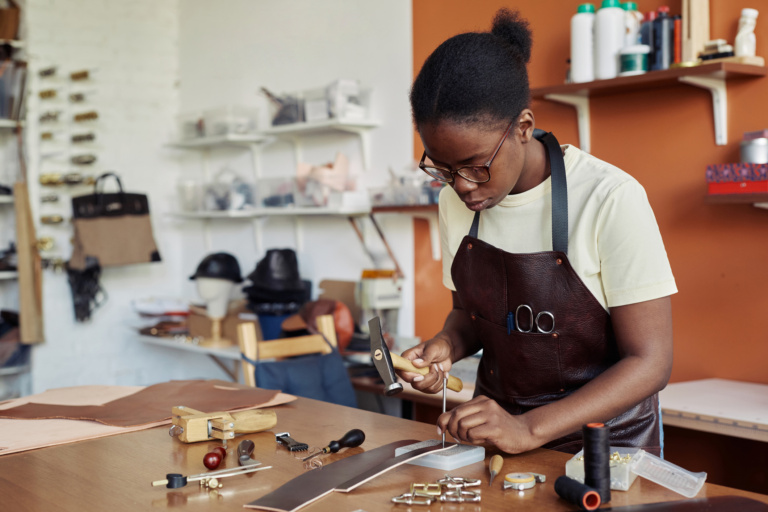 Black Young Woman Working With Leather
