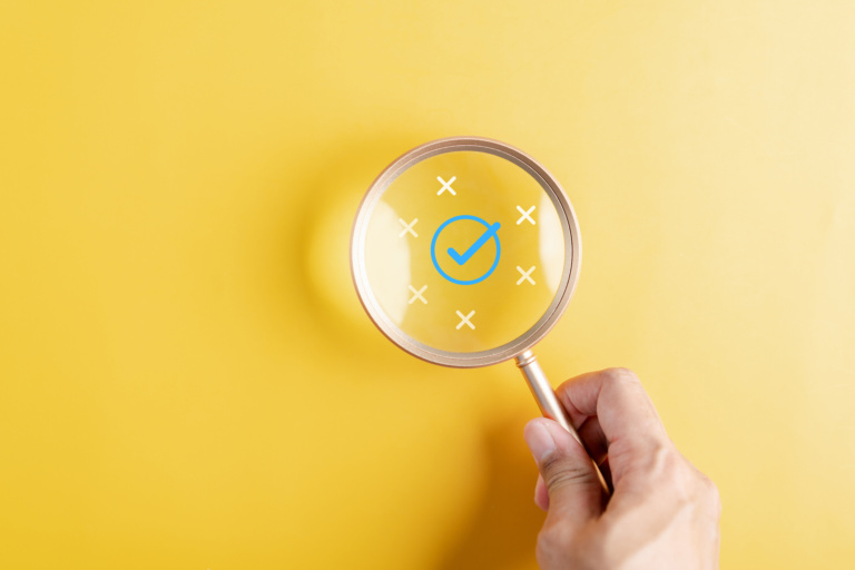 Magnifier Focus To Correct Icon Which Among Wrong Icon On Wooden Block For Document And Project Approve, Check, Mark.