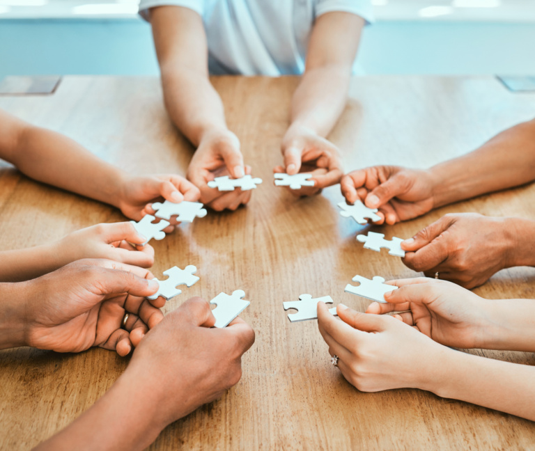 Shot Of A Family Building A Puzzle Together At Home